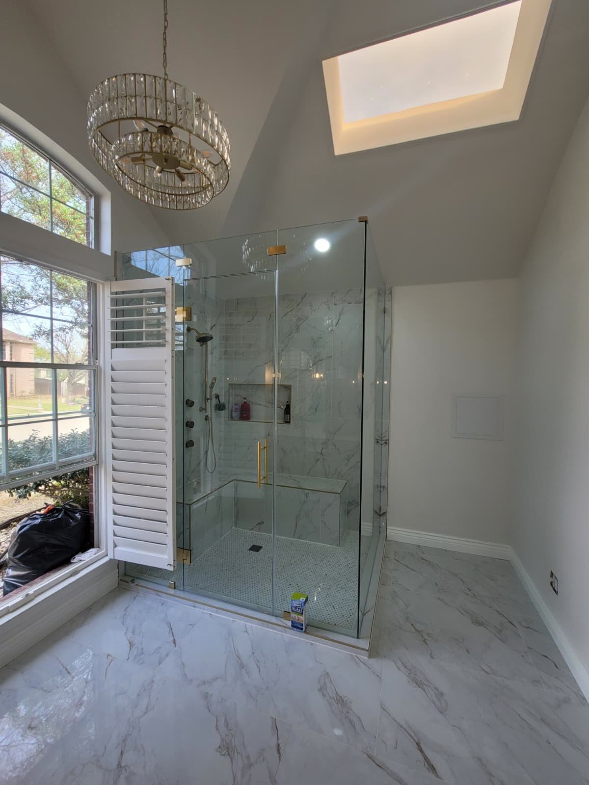 Frameless glass shower in a remodeled primary bathroom in Allen, TX