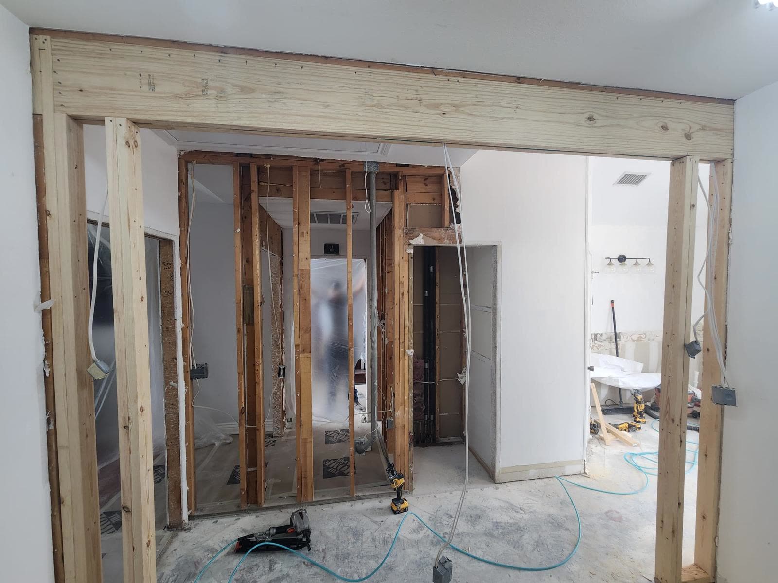 Garage conversion in progress with new framing and openings
