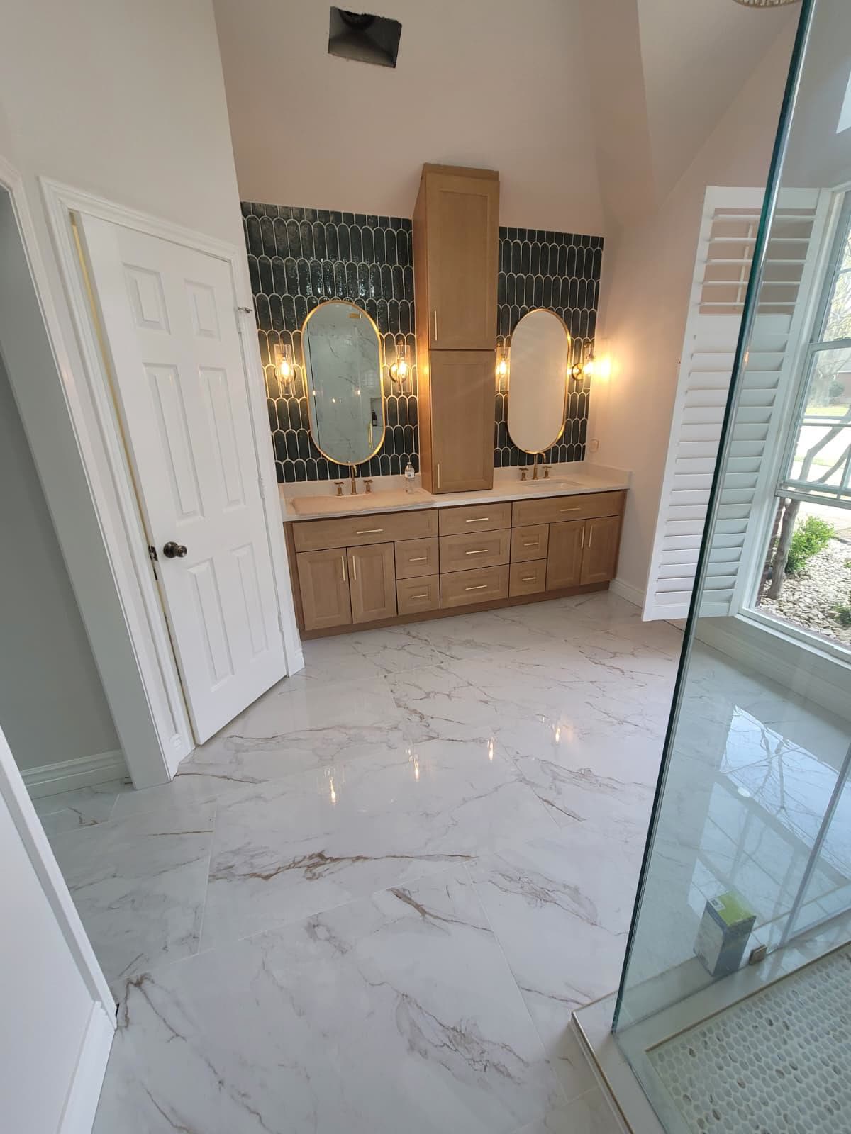 Luxury remodeled bathroom with freestanding tub and double vanity