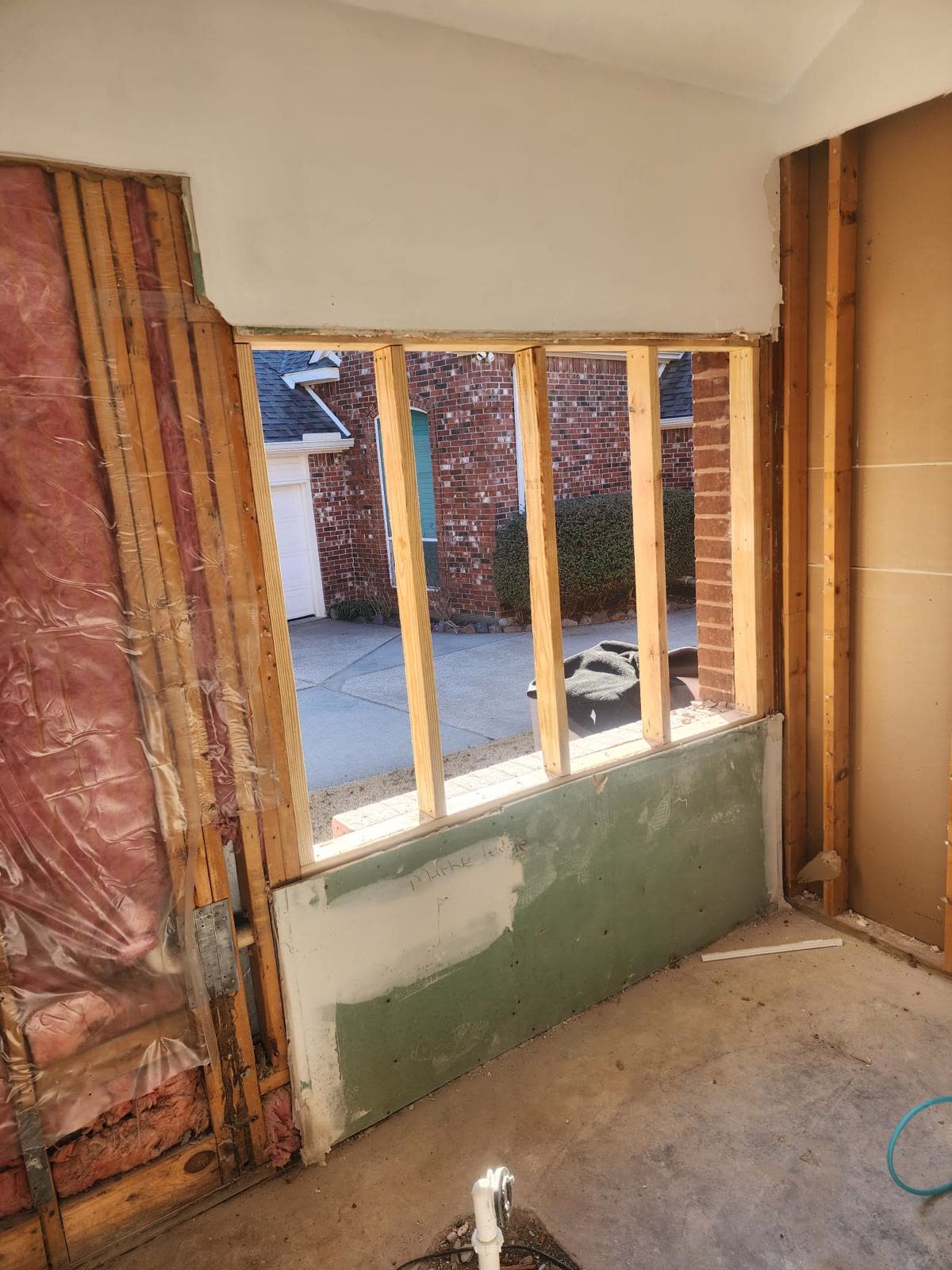Room addition framing with new window opening during construction